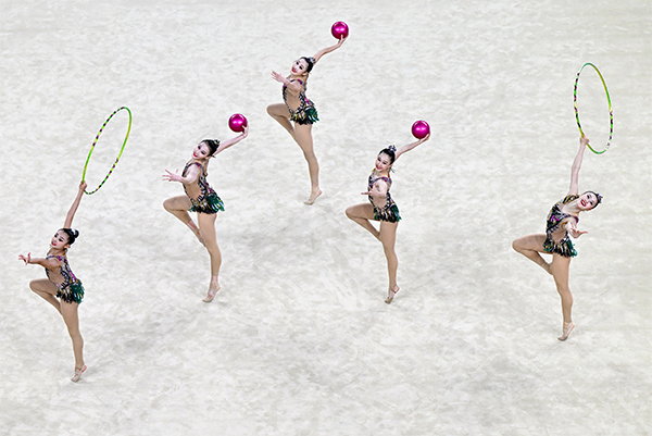 Athletes from the Sichuan team perform in the group all-around final.