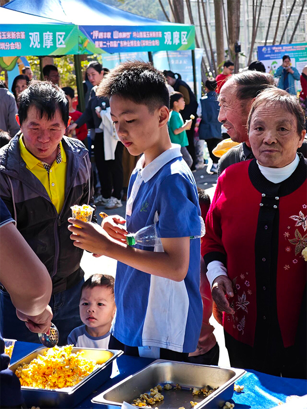 Visitors taste popcorn at the event.