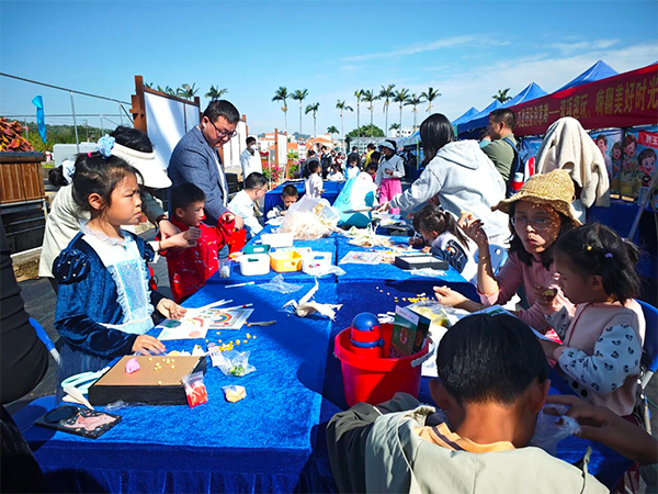 Children use grains, husks, and corn silk to create collage art.