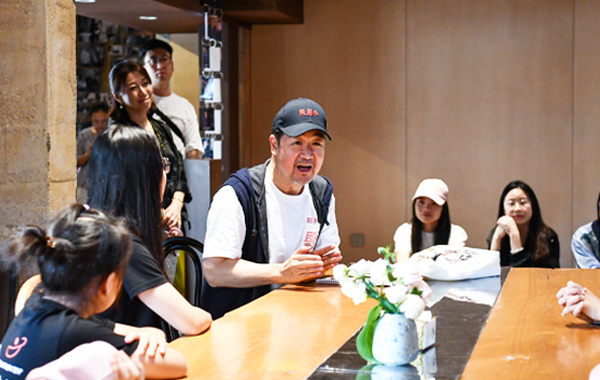 Zhang Guoli (C) talks with students at a salon held at Shenzhen Pingshan Changshou Dramaville in November 2024. Photos by Xinhua unless otherwise stated. Zhang Guoli (C) talks with students at a salon held at Shenzhen Pingshan Changshou Dramaville in November 2024. Photos by Xinhua unless otherwise stated.